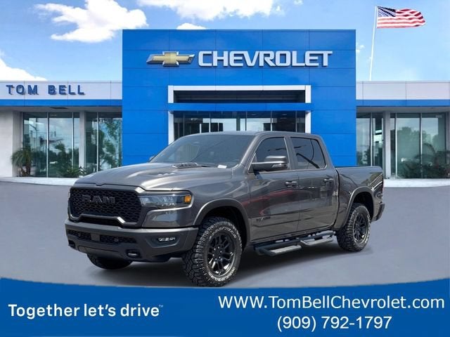 2025 RAM 1500 Rebel Crew Cab 4x4 5'7" Box in Gray — front three-quarter view