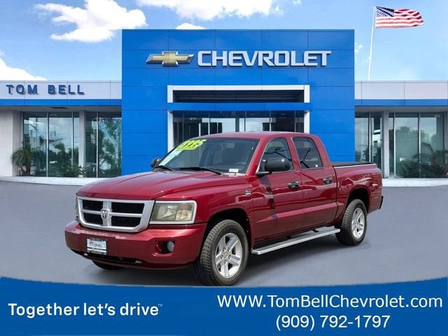 2011 RAM Dakota Bighorn/Lonestar in Red — front three-quarter view