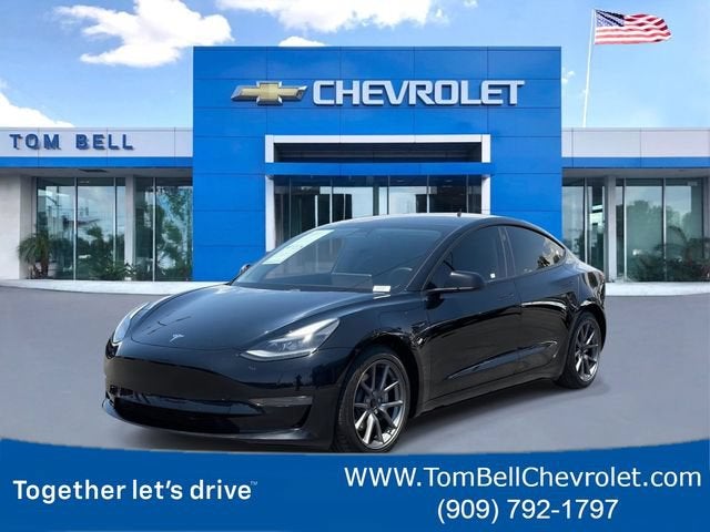 2021 Tesla Model 3 Standard Range Plus Rear-Wheel Drive in Black — front three-quarter view
